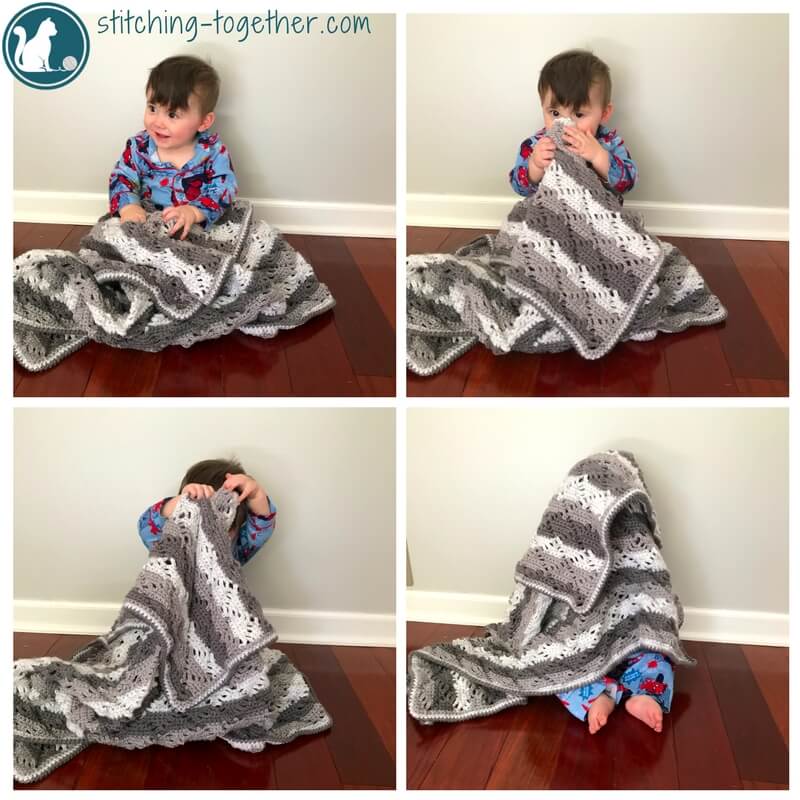 baby holding unisex crochet baby blanket - diamond lace baby blanket