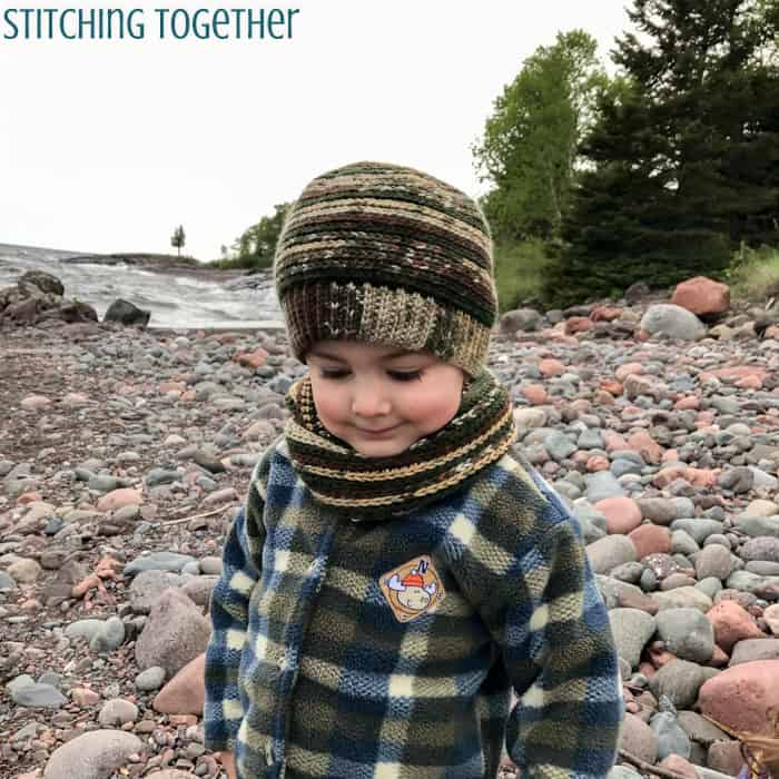 young boy wearing a crochet toddler hat in and matching scarf