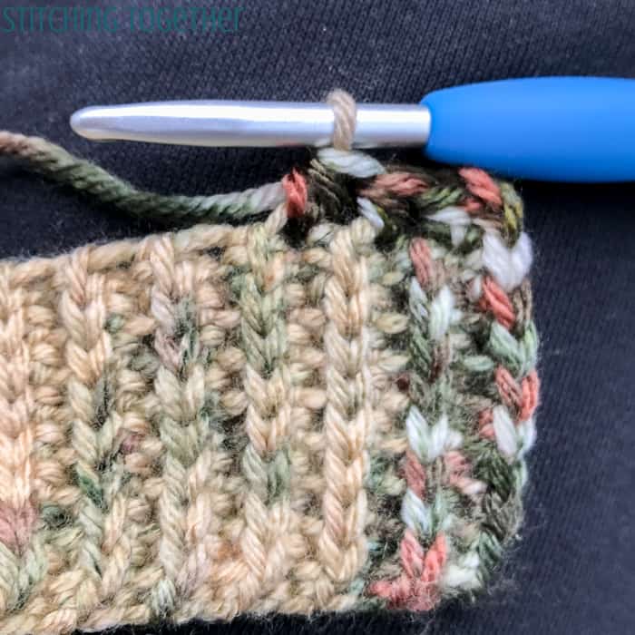 adding stitches to the top of a hat band