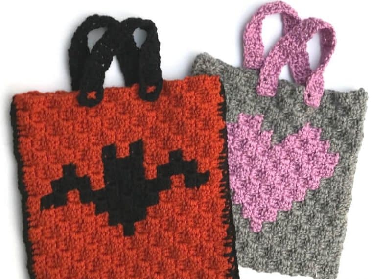 2 crochet trick or treat bags with bat and heart