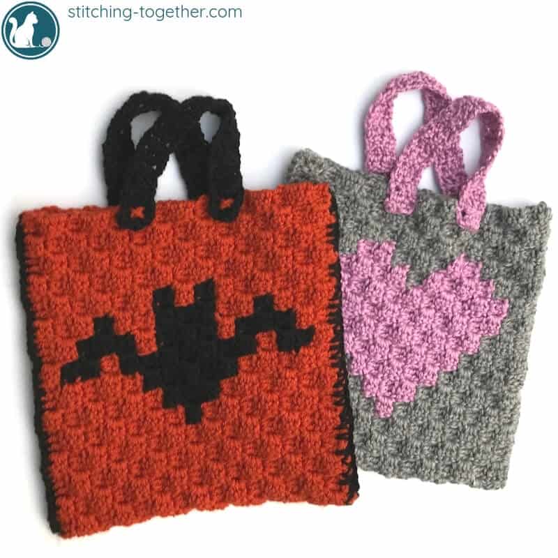 2 crochet trick or treat bags with bat and heart