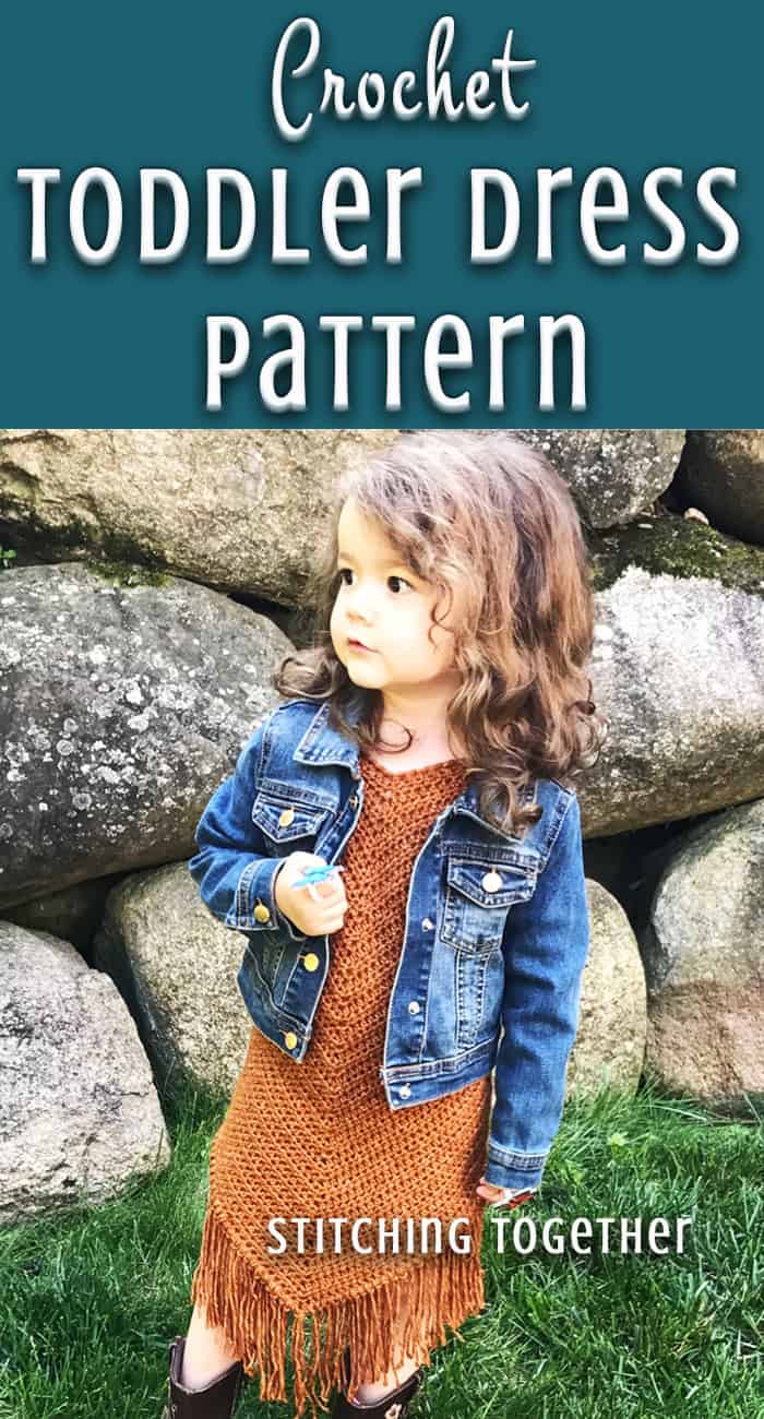 toddler in crochet dress and jean jacket