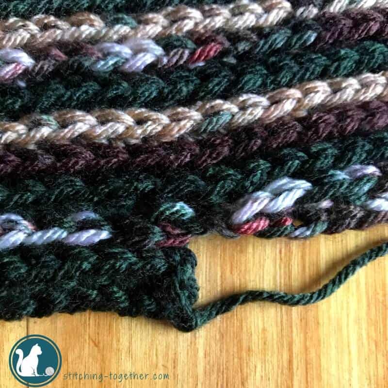 Easy Infinity scarf free crochet pattern perfect for a toddler or young kid. The varigated yarn makes the pattern stand out and makes it easily custimizable for a boy or a girl.
