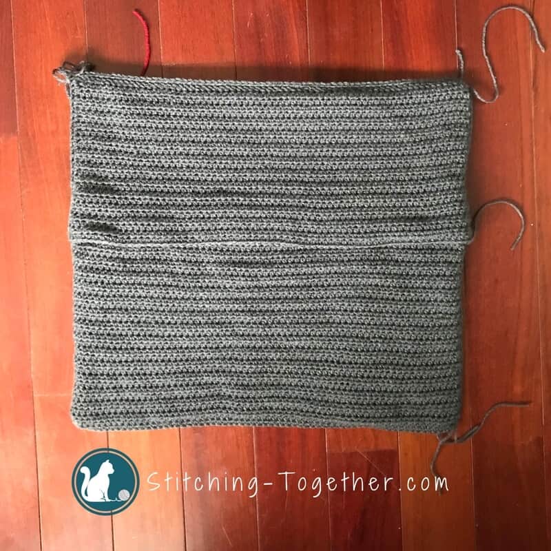 Back of gray crochet pillow cover