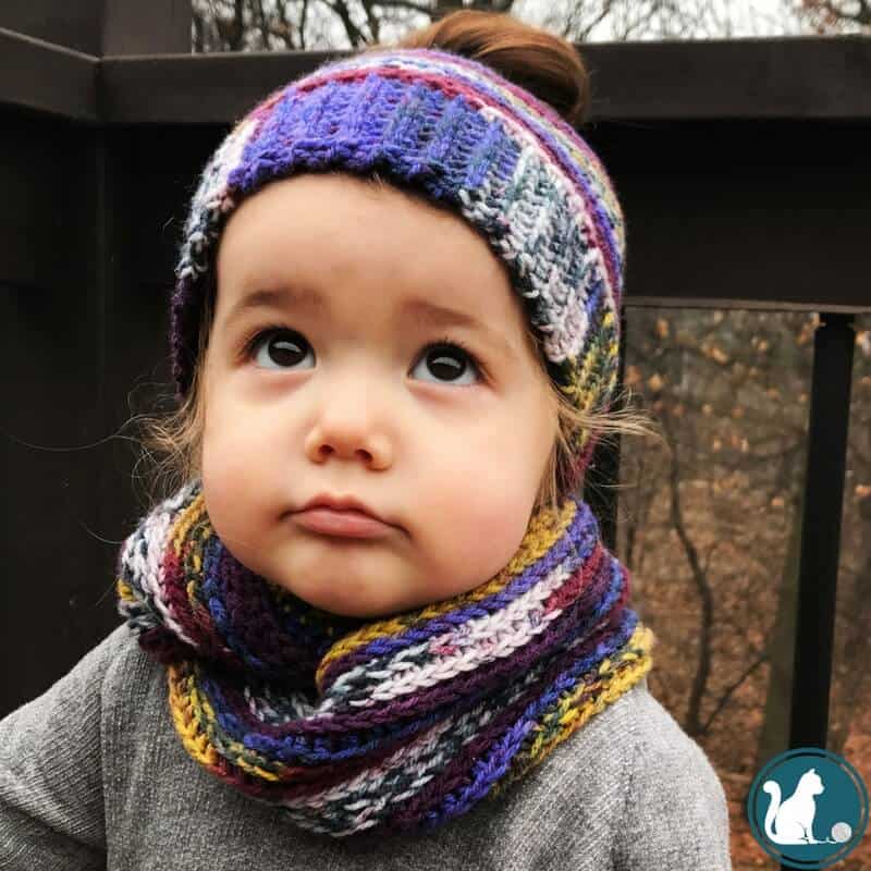 girl wearing crochet hat and scarf