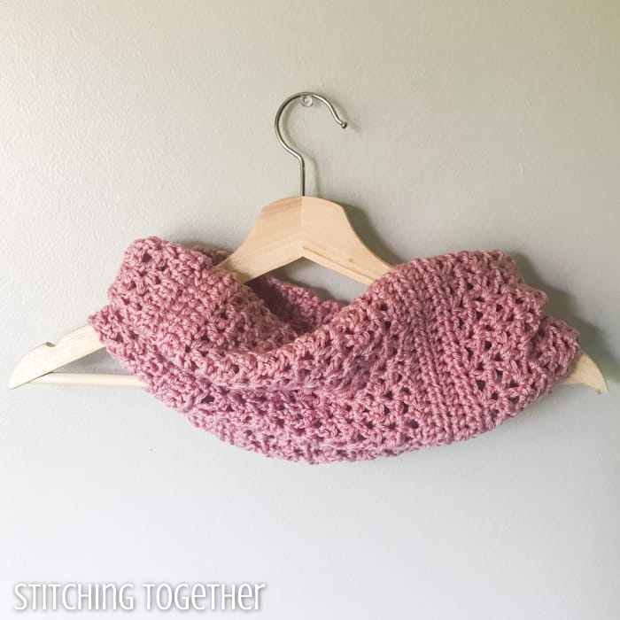 crochet cowl scarf on a hanger