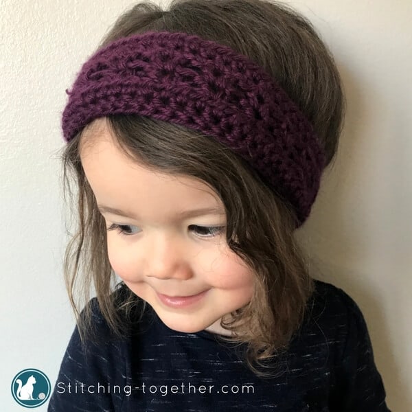 purple crochet toddler headband on little girl