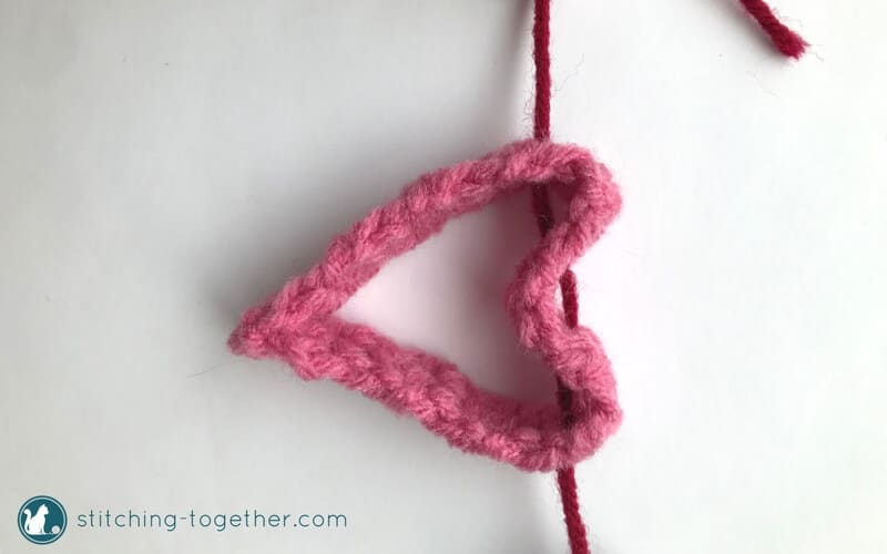 Get ready for Valentines Day with this adorable crochet heart garland. Perfect quick and easy way to DIY your Valentines Day decor. The garland would also make a cute decoration for a little girls room. | Free crochet pattern #ValentinesDaydecro #heartsgarland #crochethearts #freecrochetpattern