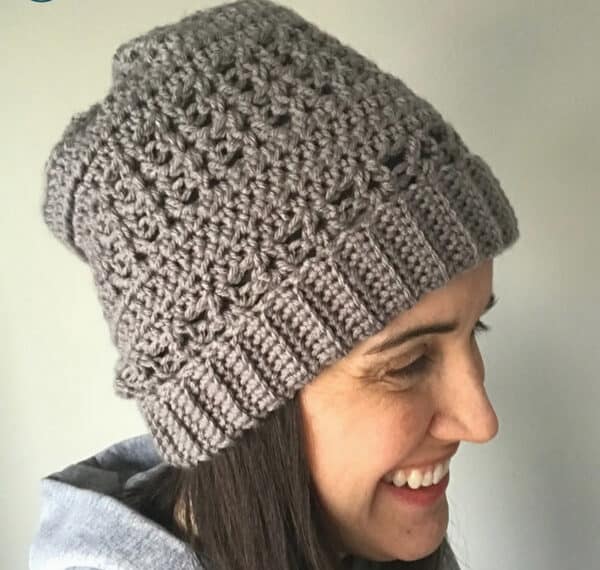 Check out this fun and unique crochet slouchy hat. There is a free pattern so you can make your own! Since the hat is first made by crocheting a rectangle, there is no working in the round. This is a perfect free crochet pattern for a hat making beginner. #crochet #crochethat #crocheting #crochetfreepattern