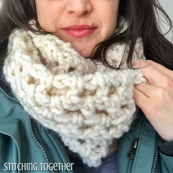 lady wearing a beginner crochet infinity scarf