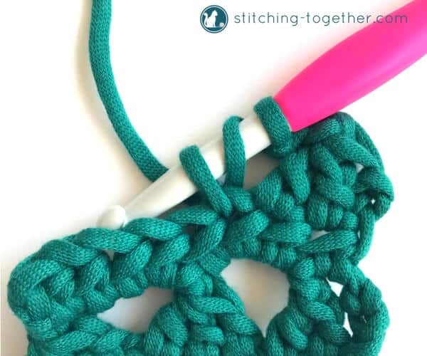 Learn how to crochet the Modified Cluster stitch with this full photo tutorial. The stitch creates adorable triangles which are great for scarves or accessories. 