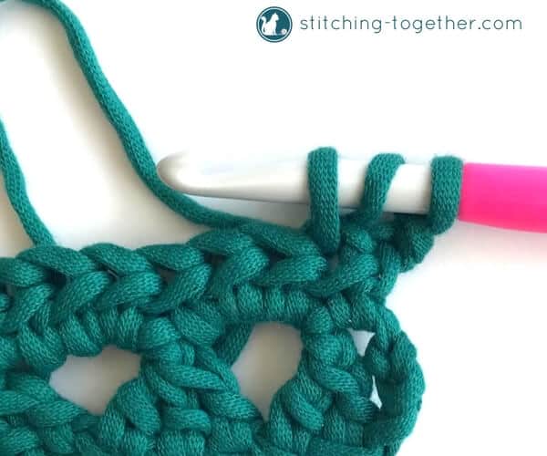 Learn how to crochet the Modified Cluster stitch with this full photo tutorial. The stitch creates adorable triangles which are great for scarves or accessories. 