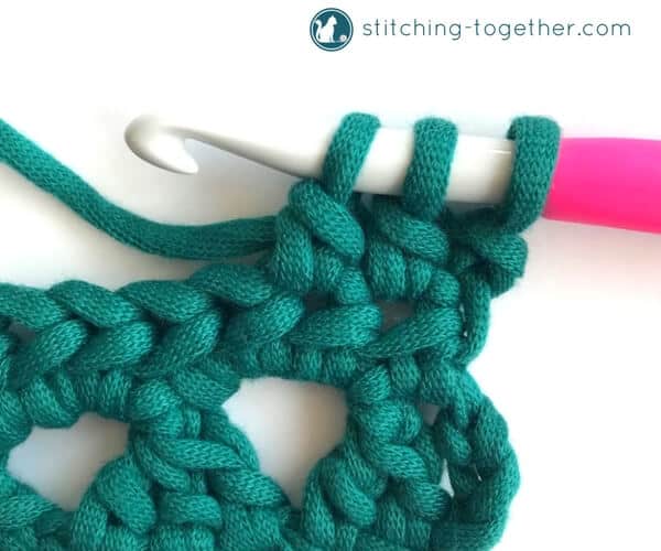 Learn how to crochet the Modified Cluster stitch with this full photo tutorial. The stitch creates adorable triangles which are great for scarves or accessories. 