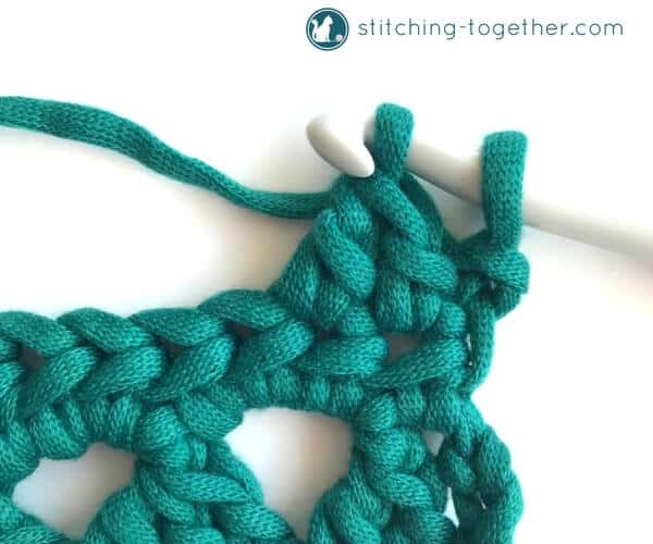 Learn how to crochet the Modified Cluster stitch with this full photo tutorial. The stitch creates adorable triangles which are great for scarves or accessories. 