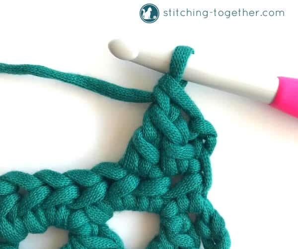 Learn how to crochet the Modified Cluster stitch with this full photo tutorial. The stitch creates adorable triangles which are great for scarves or accessories. 