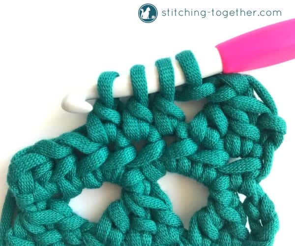 Learn how to crochet the Modified Cluster stitch with this full photo tutorial. The stitch creates adorable triangles which are great for scarves or accessories. 