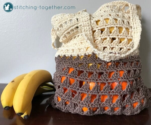 color block crochet market bag filled with oranges and bananas