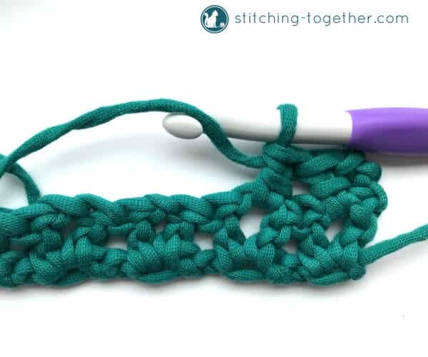 Learn how to crochet the v-stitch with this easy photo tutorial. The tutorial also includes instructions on how to add rows of other stitches on to your v-stitches. The stitch pattern is also known as the open v-stitch or dc v-stitch. What will you make with these stitches?