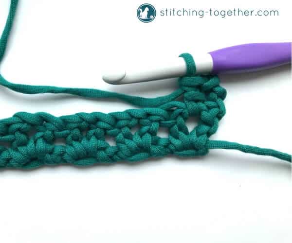 Learn how to crochet the v-stitch with this easy photo tutorial. The tutorial also includes instructions on how to add rows of other stitches on to your v-stitches. The stitch pattern is also known as the open v-stitch or dc v-stitch. What will you make with these stitches?