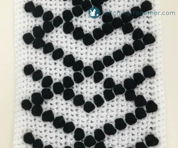 Yarn wall hangings are all the rage right now and they are SO EASY to DIY. This modern wall hanging will add a great pop of texture to your home decor. The fun bobbles really make this modern wall hanging unique.