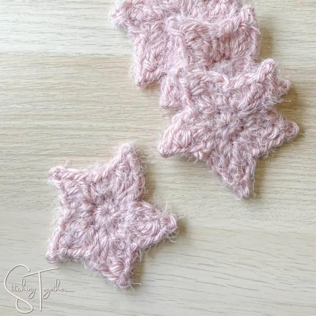 stack of fuzzy pink crochet stars