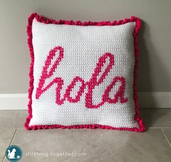 Get your house fiesta ready with this adorable hola crochet pillow pattern. This easy and free crochet pattern combines crochet and cross stitch to make a fun crochet cushion for your couch. Give your pillows a cover that will make them stand out in your living room!
