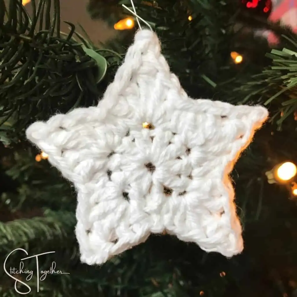 white small crochet star used as a Christmas ornament