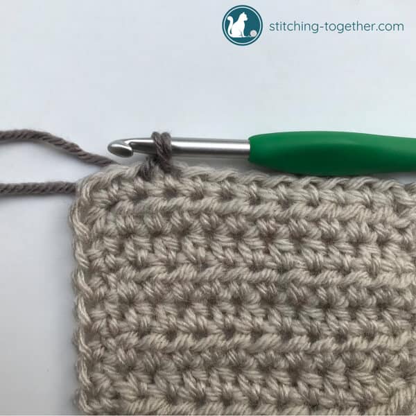 yarn over and pull through loop to complete crab stitch