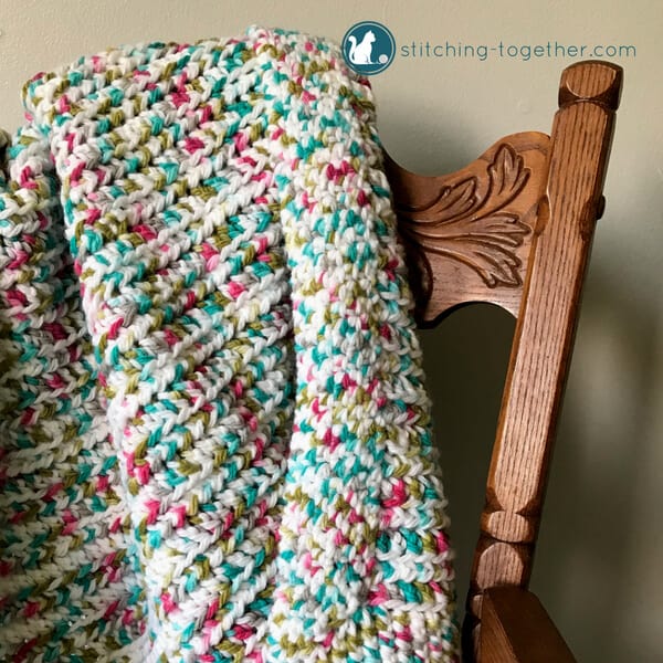 Close up of easy crochet baby blanket on chair