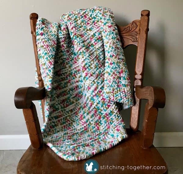 stroller blanket on chair