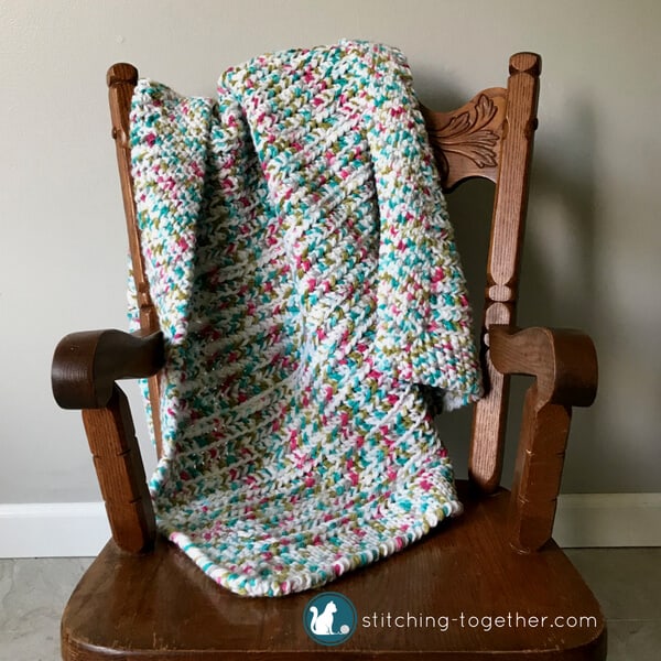 stroller blanket on chair