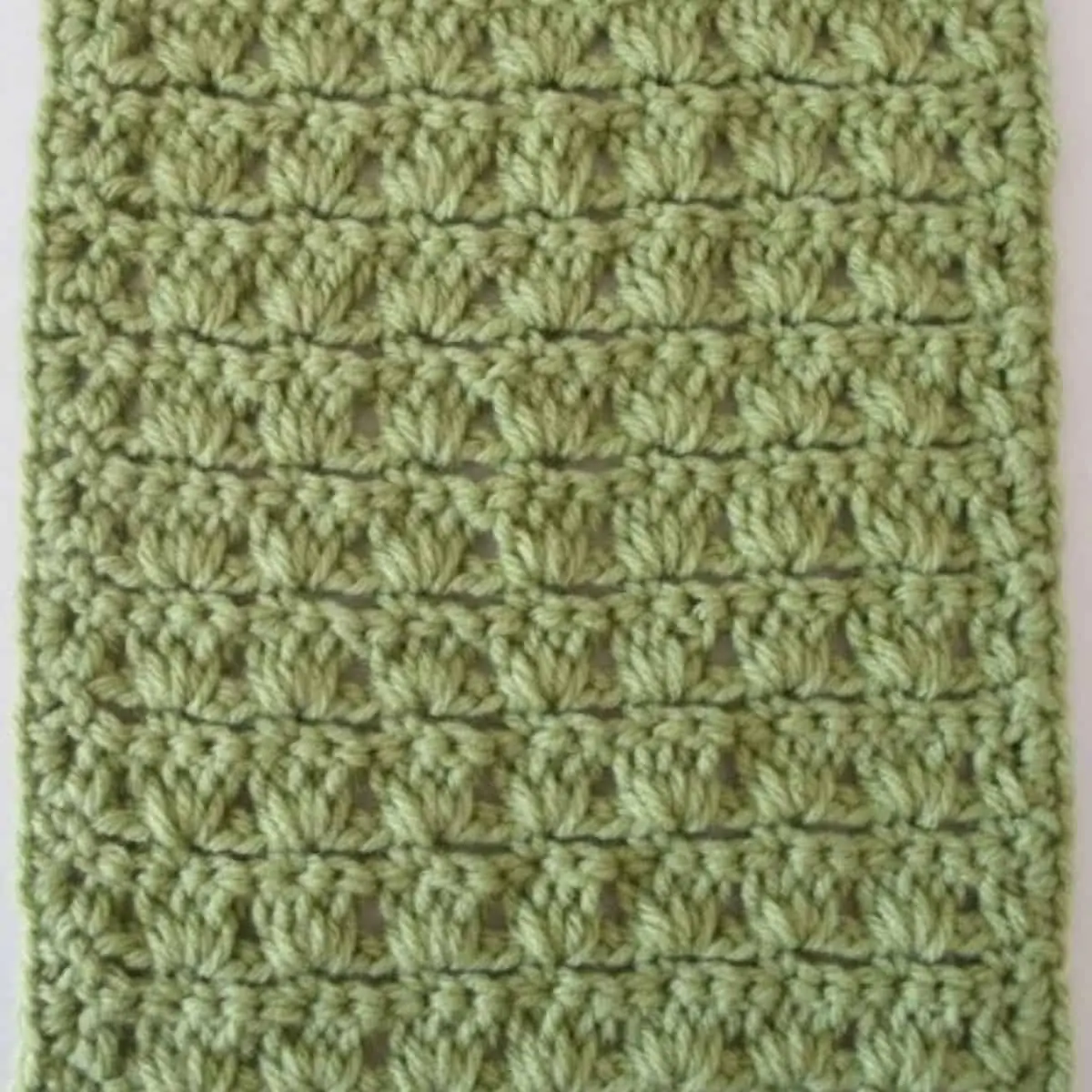 close up of a green swatch of textured crochet stitches