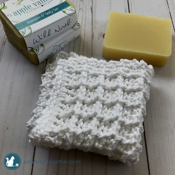 https://www.stitching-together.com/wp-content/uploads/2018/08/Waffle-stitch-washcloth-next-to-soap.jpg