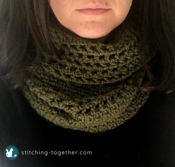 close up of green crochet cowl