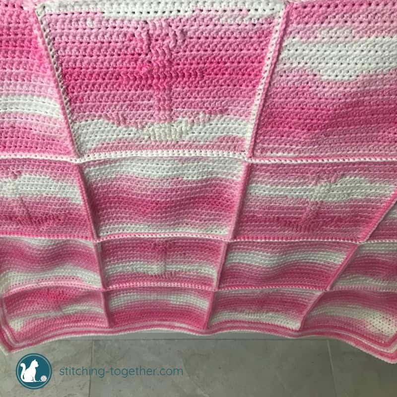 hanging pink crochet baby blanket