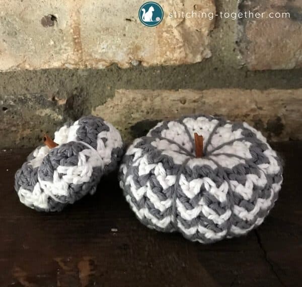 two crochet pumpkins