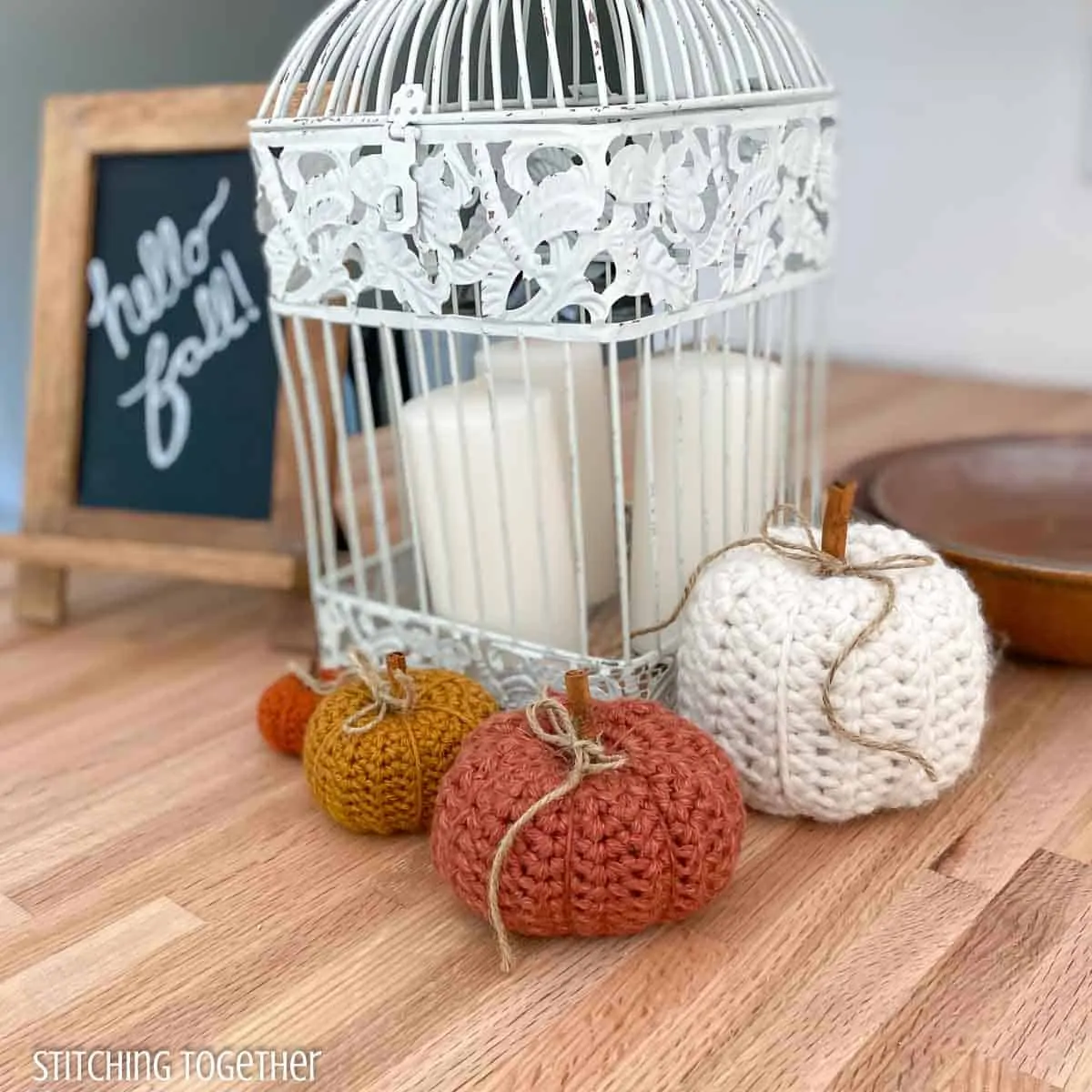 4 crochet pumpkins around fall themed decor