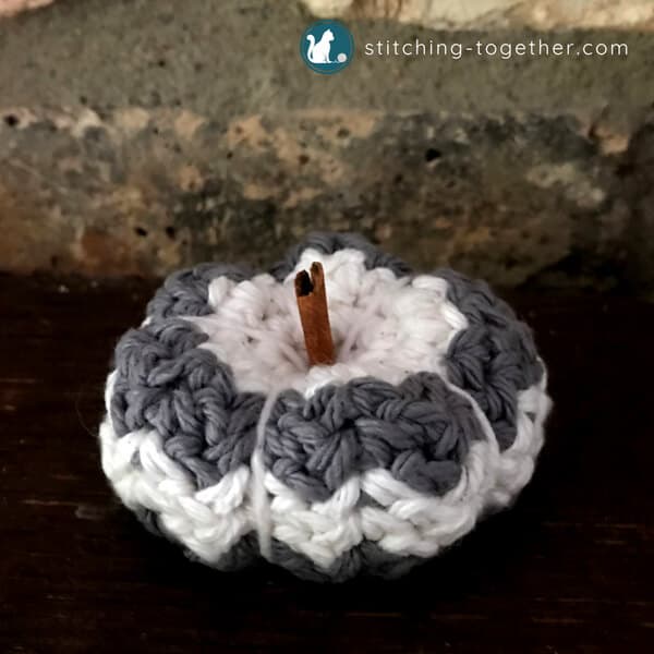 petite country crochet pumpkin with cinnamon stick