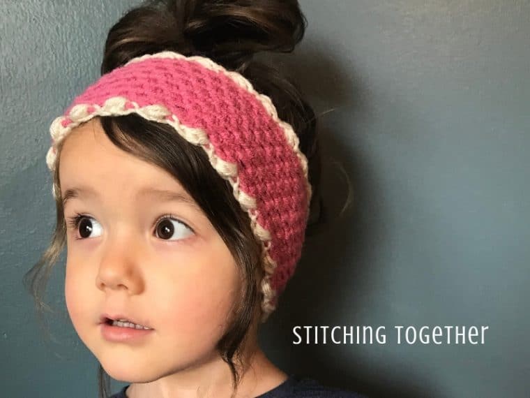 young girl wearing pink crochet ear warmer