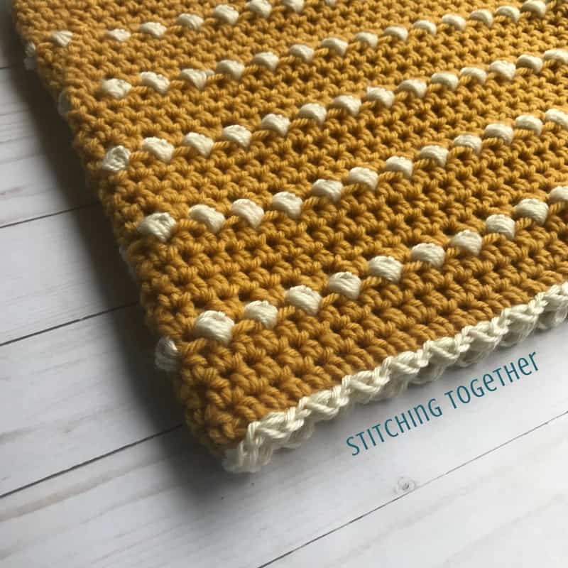 Mustard cowl crochet close up with puff stitches