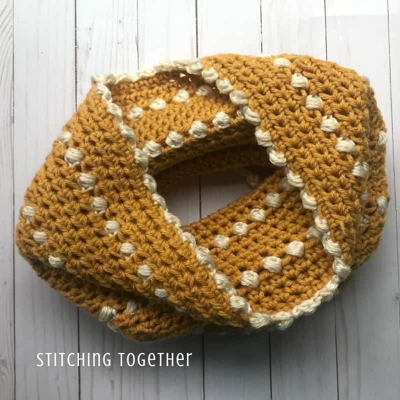 gold crochet cowl with white puff stitches
