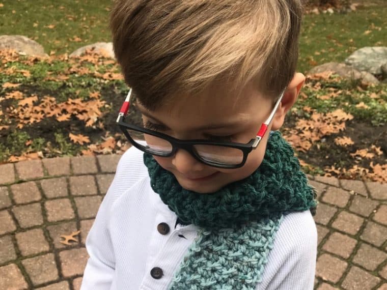 boy wearing a crochet scarf for a boy