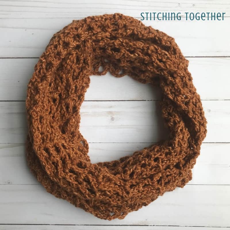 copper colored one skein crochet scarf in a circle