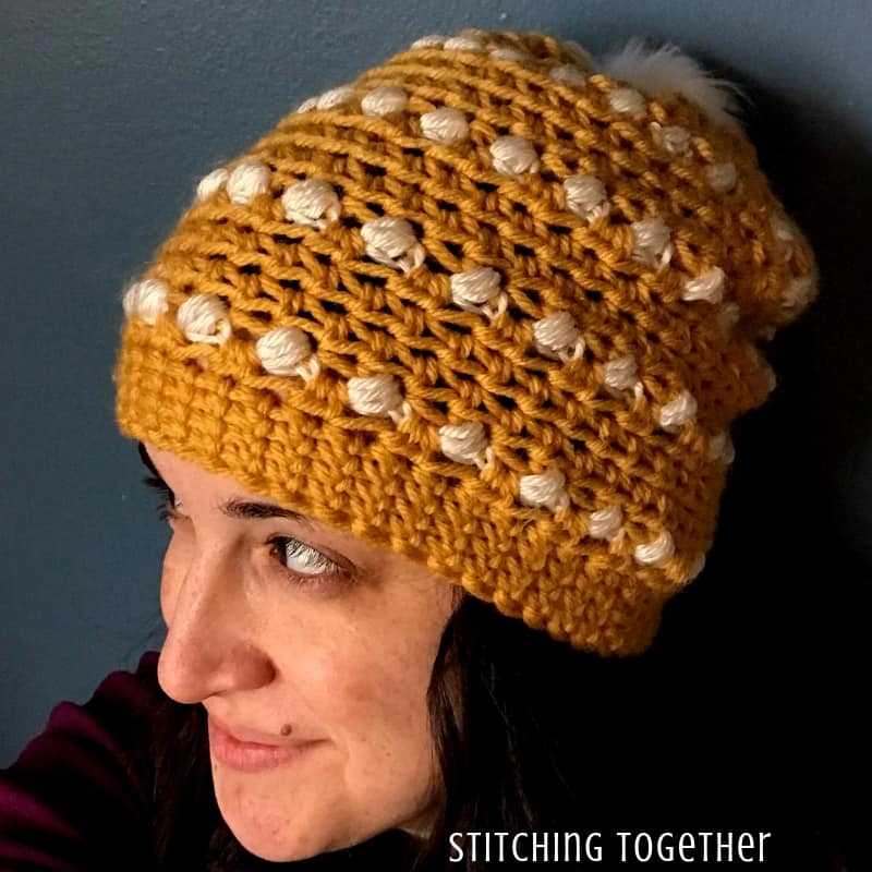 puff stitch crochet hat on a lady