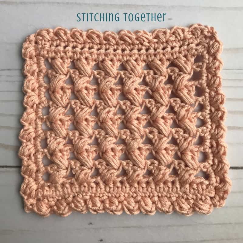 pink square crochet coaster with lacy stitches
