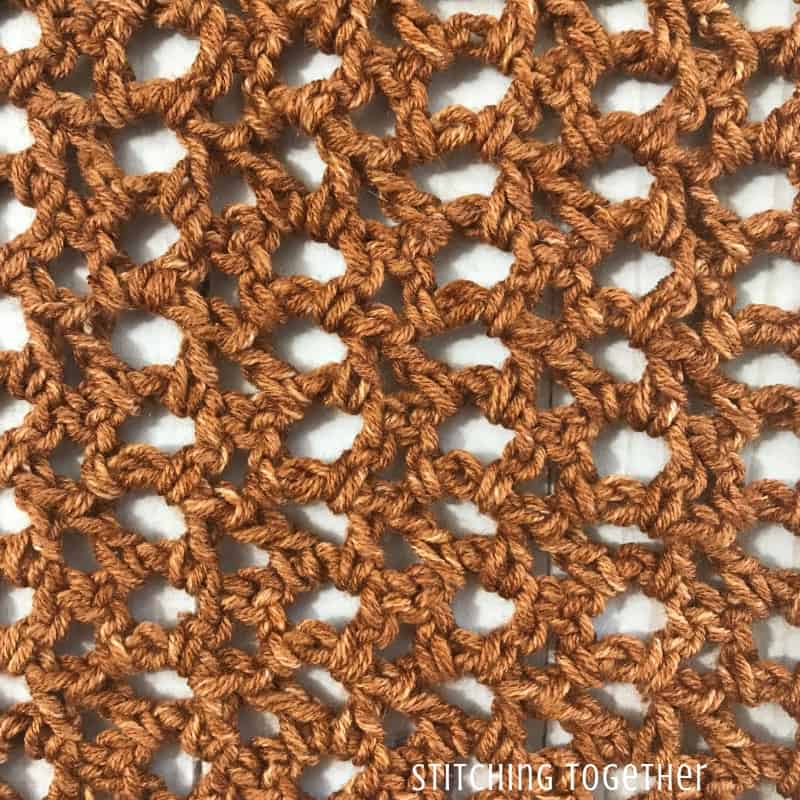 close up of copper colored crochet stitches