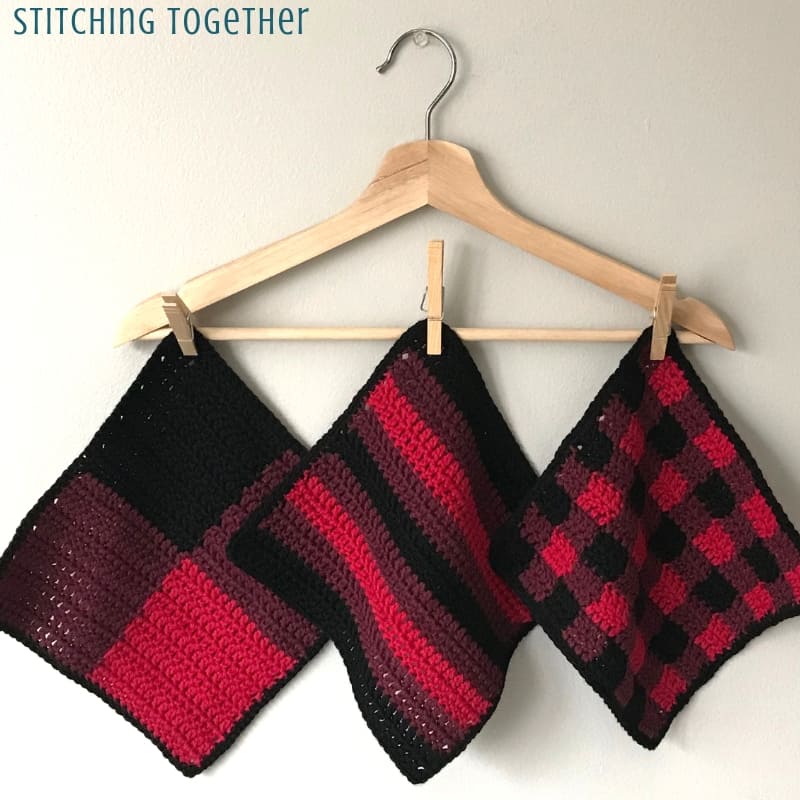 Buffalo plaid crochet dishcloth hanging on a hanger