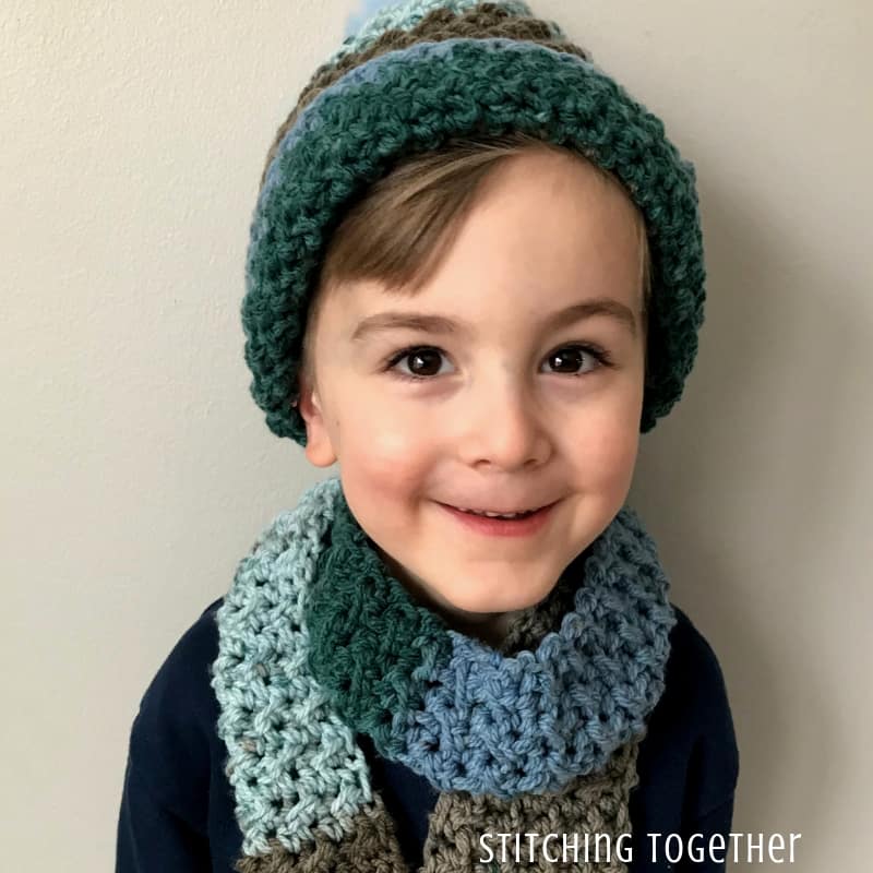 boy wearing crochet hat with folded brim