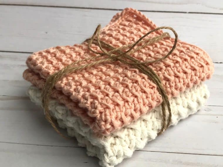stacked crochet washcloths tied with jute