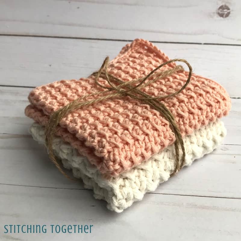 stacked crochet washcloths tied with jute